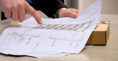 Vehicle-mover-custom-built-for-confined-spaces-man-pointing-towards-a-map-of-confined-spaces
